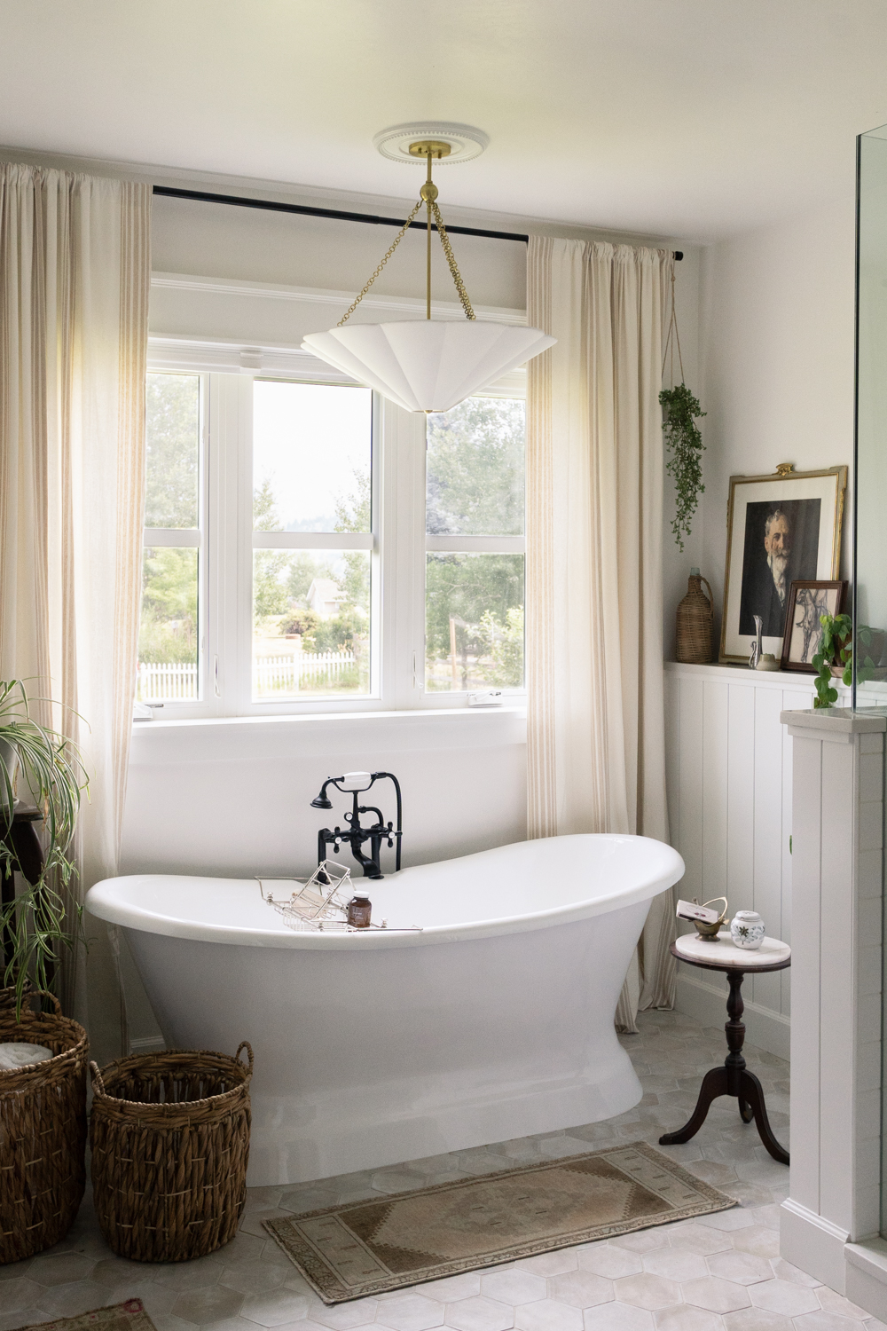 Vintage Bathroom with Standing Tub and Worn Tile